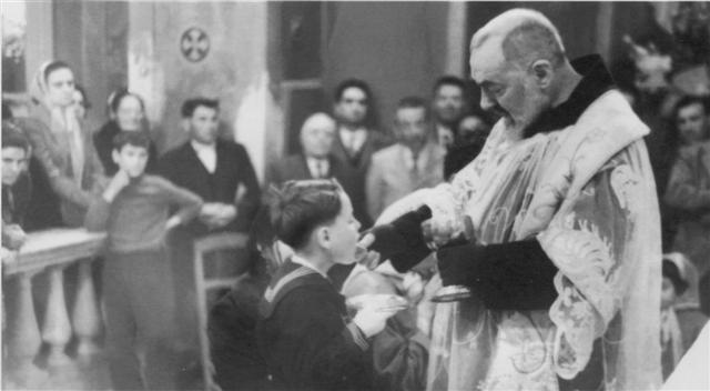 Padre Pio giving out communion
